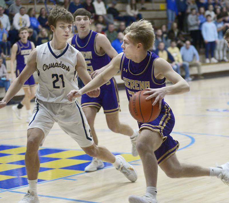 Serena’s Tanner Faivre races to the basket ahead of Marquette’s Charlie Mullen  during the 1st period Tuesday at Marquette.