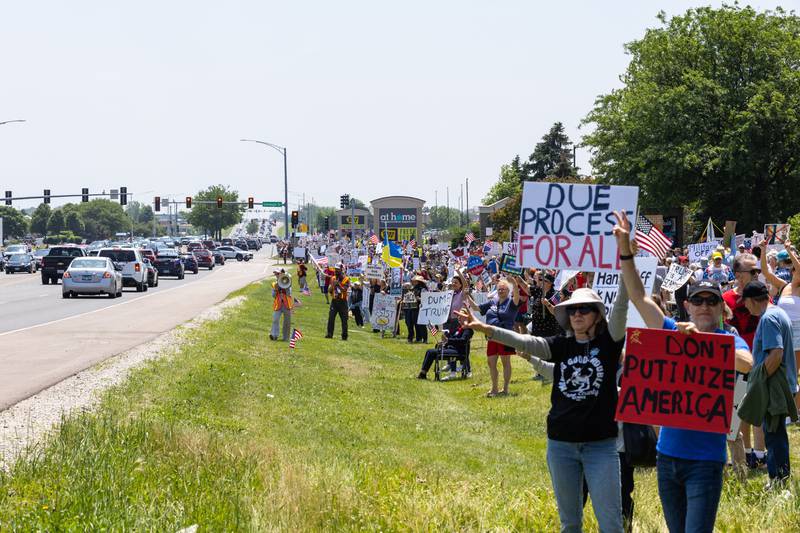 Protesters gather on South Randall Road for a “No Kings Day” Protest against President Donald Trump’s policies along South Randall Road in Geneva on Saturday, June 14, 2025.