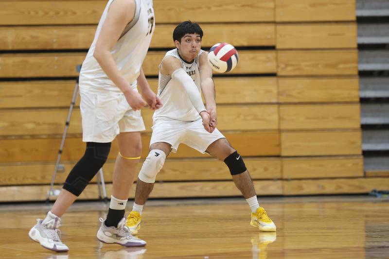 Joliet West’s Jafet Cerda receives a serve against Lockport on Tuesday, March 31, 2026 in Joliet.