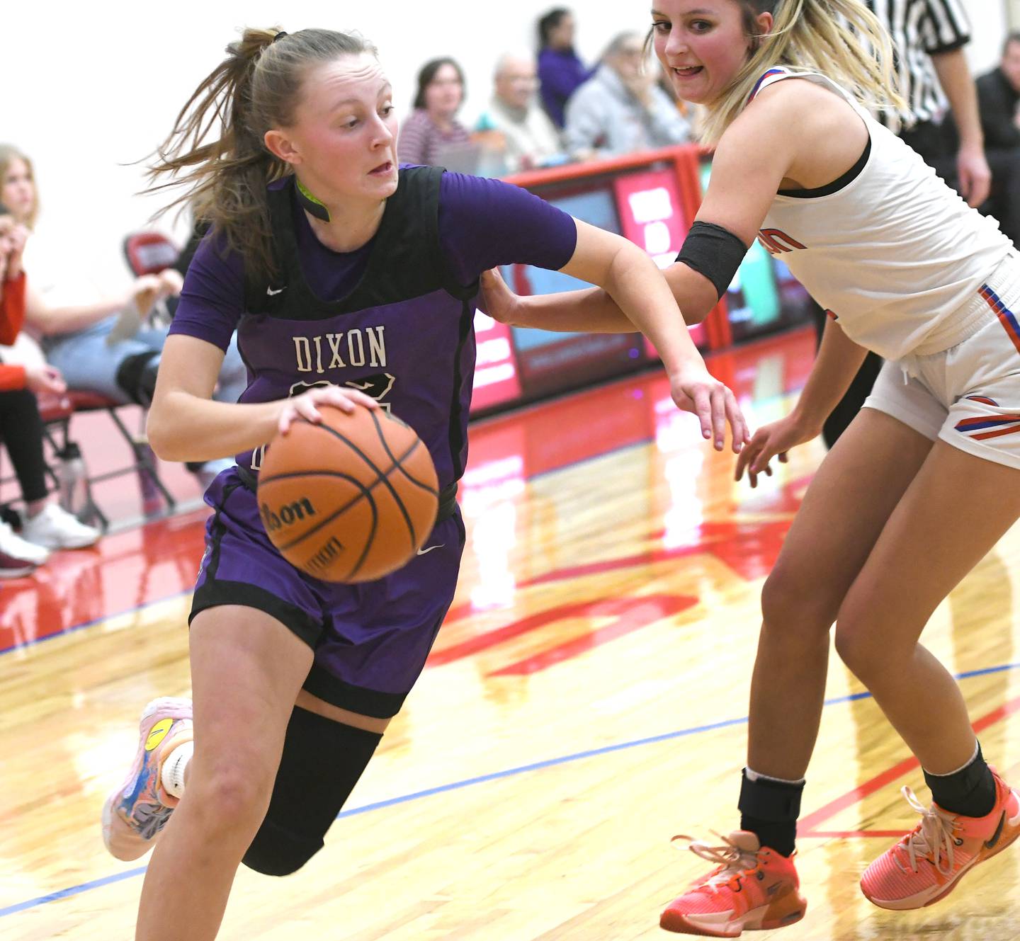 Dixon's Katie Drew (22) drives on Oregon's Ava Hackman during Big Northern Conference action at the Blackhawk Center in Oregon on Saturday, Jan, 21.