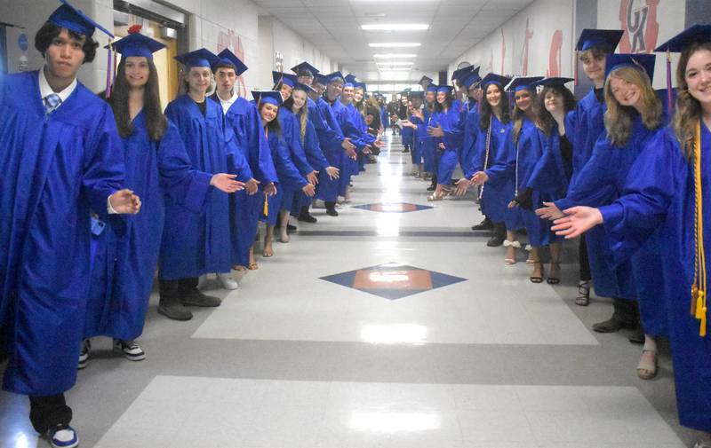 Genoa-Kingston graduates line the hallway Sunday, May 17, 2026, during the commencment ceremony at Genoa-Kingston High School.