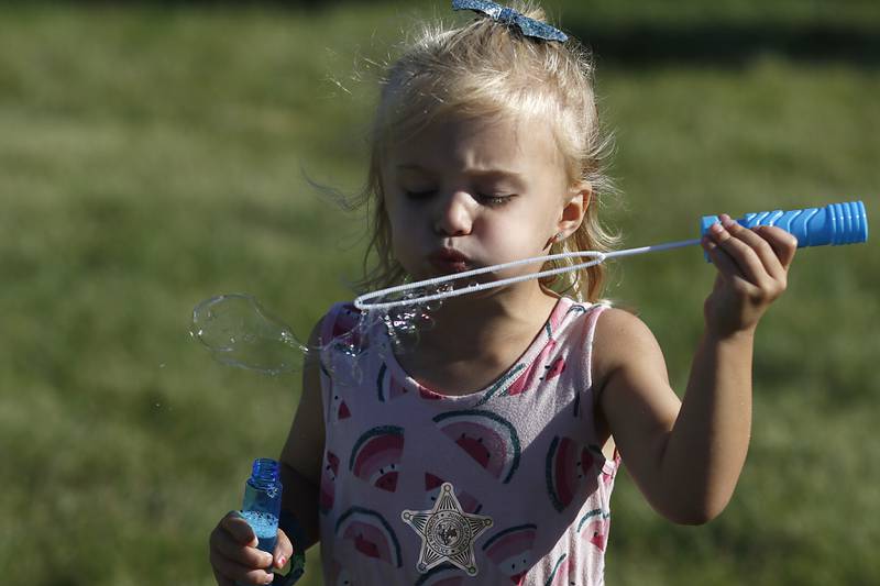 Lennyn O’Donnell, 3, of Algonquin, blows bubbles during the Algonquin Founders’ Days Festival Friday, July 29, 2022, at Ted Spella Community Park, 2610 Harnish Drive, in Algonquin. This year marks the festival’s 60th anniversary that includes over 40 events, including live music, food and drinks, a carnival, and market bazaar. The festival runs from 2 to 11 p.m. July 30 and 10 a.m. to 9 p.m. July 31. A Founders’ Day Christmas in July Parade will run through Main Street in downtown Algonquin beginning at 11 a.m. July 30.