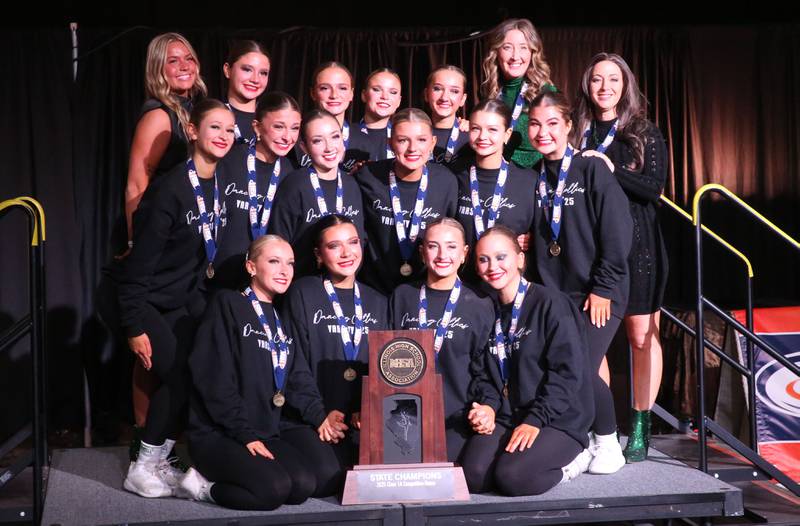 Members of the Providence Catholic dance team pose with  the Class 1A HSA State Dance trophy on Saturday, Feb. 1, 2025 at Grossingers Motor Arena in Bloomington.
