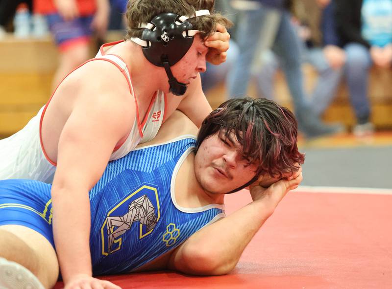 Yorkville's Fenolio goes up against against Joliet Central's Vincencio-Ram during the Southwest Prairie Conference wrestling meet at Yorkville High School on Saturday, Jan. 21, 2023.