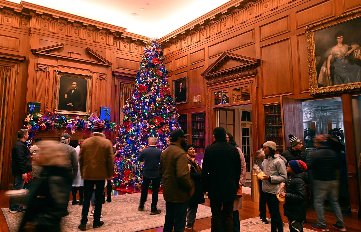 Guests tour Freedom Hall inside historic McCormick House during a Christmas at Cantigny preview Wednesday.