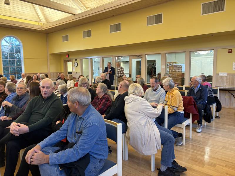 Audience members talk during FaithBridge's Thanksgiving program Nov. 23, 2025 in Crystal Lake.