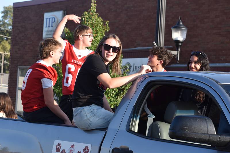 Streator High School students ride Wednesday, Oct. 2, 2024, in the homecoming parade.