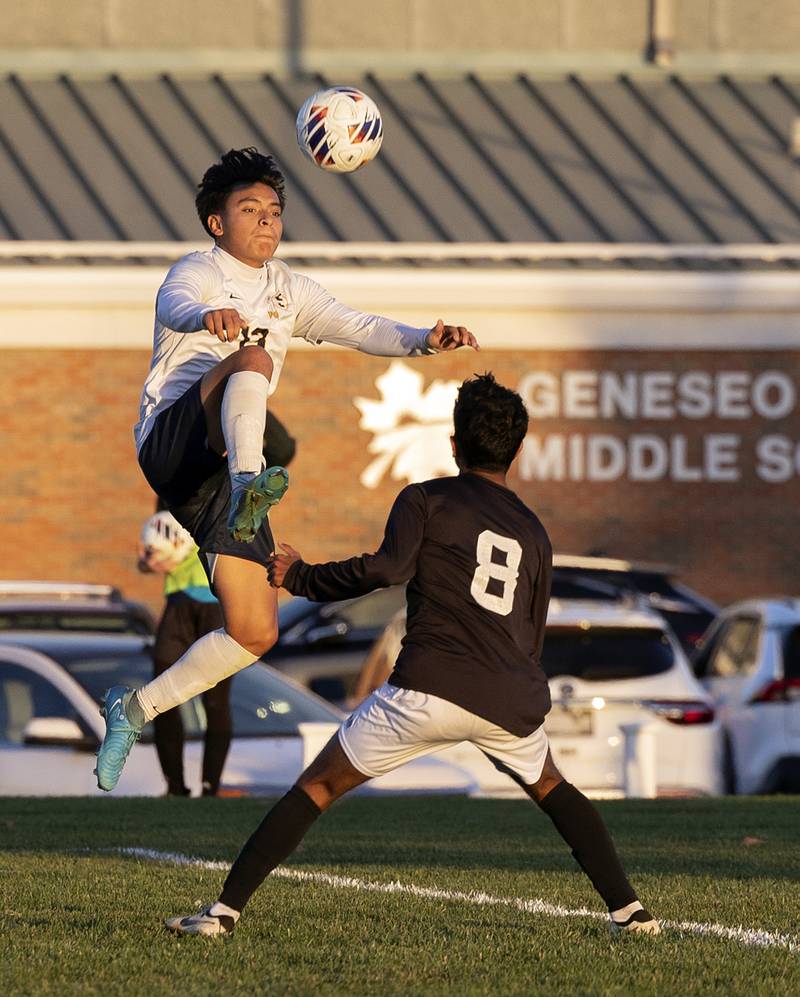 Sterling’s Luis Milan goes up to make a play against Dunlap’s Rohan Issac Wednesday, Oct. 23, 2024, during the class 2A soccer regional semifinal in Geneseo.
