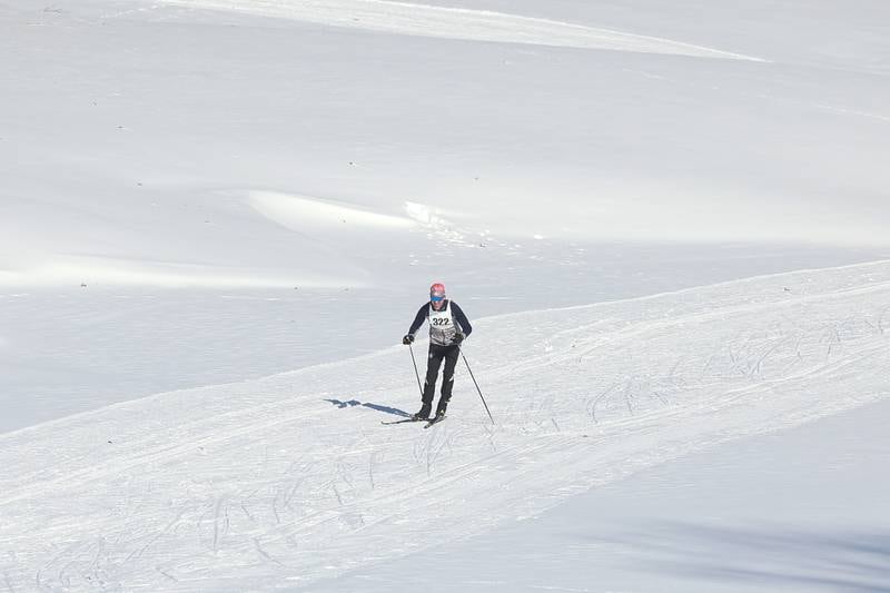 Alexander Loney, of Glen Ellyn, coast along a slope in the course in the Joliet Nordic Ski Club 12k race on Saturday, Jan. 20th, 2024 at Woodruff Golf Course in Joliet.