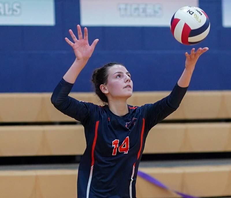 Oswego’s Mia Jurkovic (14) serves the ball against Yorkville during a volleyball match at Oswego High School on Thursday, Sept. 14, 2023.