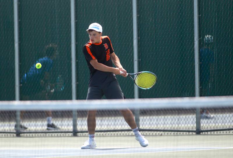 DeKalb’s Rylan Lottes returns the ball during the first round of the 2A boys state tennis meet with doubles partner Matthew Williams (not pictured) on Thursday, May 29. 2025 at Hersey High School.