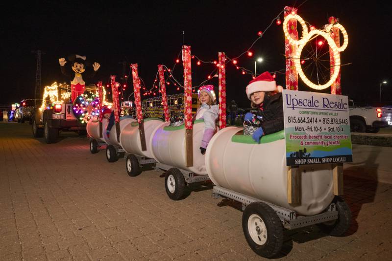 Upscale Resale's entry into the parade had a fun holiday themed barrel ride for the kids. The float was one of many that lit up the night on November 25, 2023 in Spring Valley.