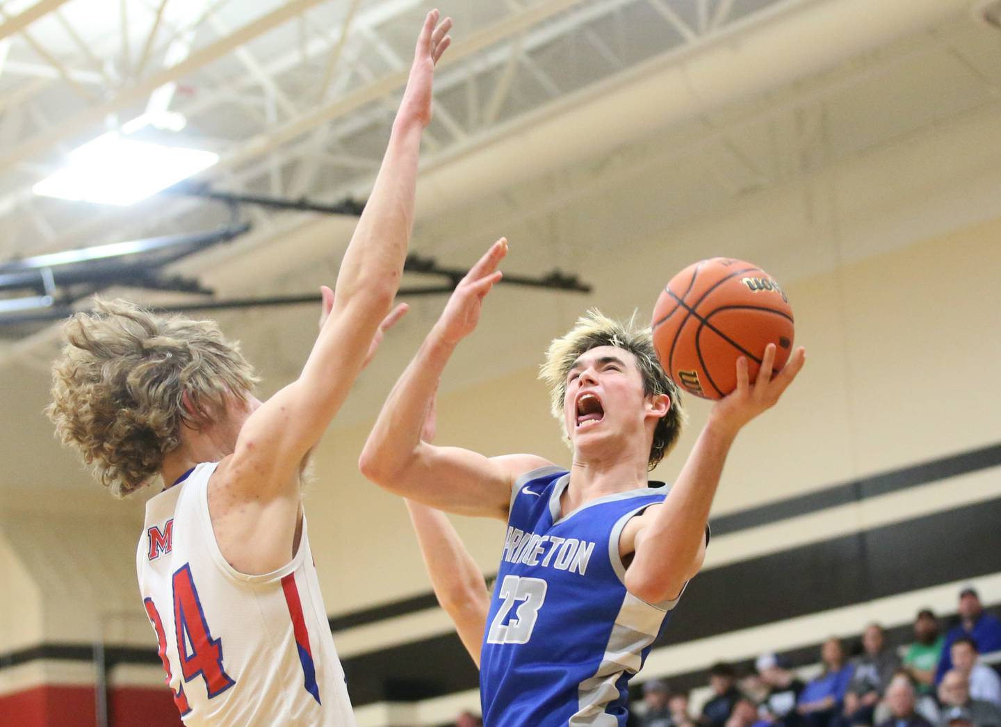 Princeton's Noah LaPorte eyes the hoop over Morrison's Brenden Martin during the Class 2A Regional final game on Friday, Feb. 23, 2024 at Erie-Prophetstown High School.