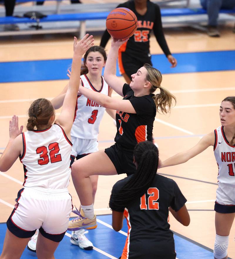 DeKalb’s Ella Russell drives around Belvidere North's Camryn Diercks during their game Friday, Nov. 17, 2023, in the Mark Einwich Varsity Girls Basketball Rockets Kickoff Tournament at Burlington Central High School.