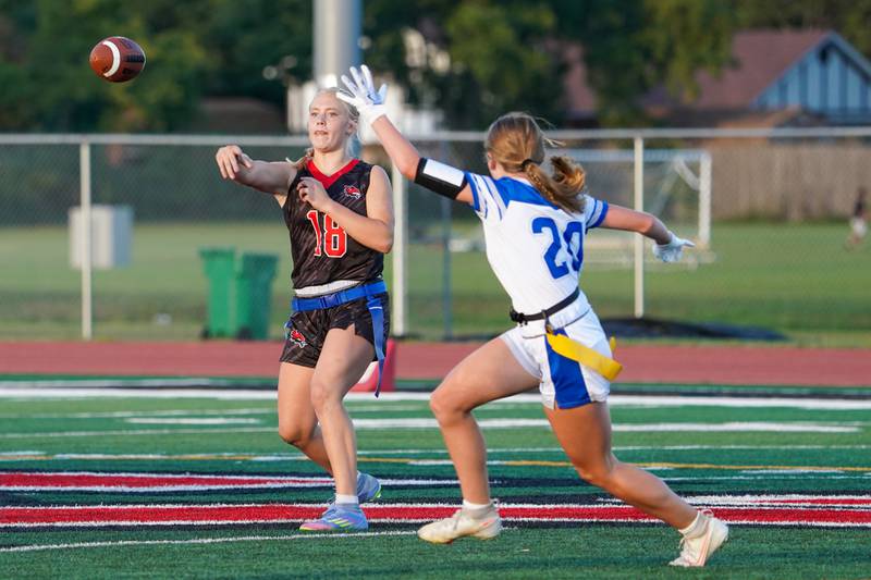 Yorkville's Brooke Ekwinski (18) throws a pass against Geneva’s Hadley Mason (20) during a non-conference game at Yorkville High School on Tuesday, Sept. 2, 2025.