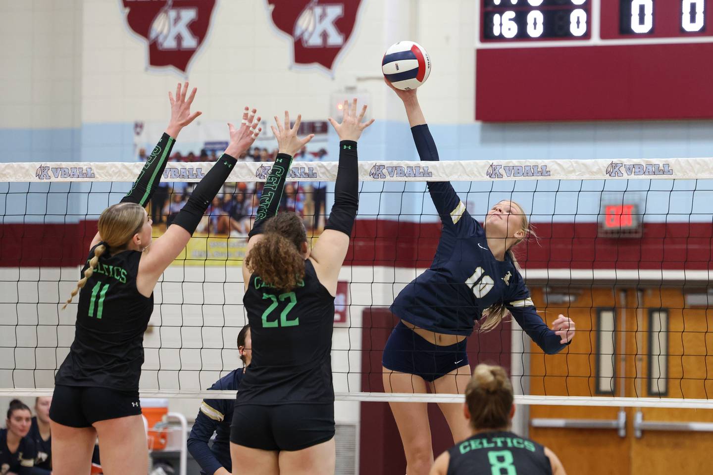 Lemont's Marta Pranskunas spikes the ball against a block by Providence's Grace Lustig (22) and Abbey Knight during Lemont's loss two sets, 25-25, 25-18, to Providence in the IHSA Class 3A Kankakee Sectional championship on Thursday, Nov. 6, 2025.