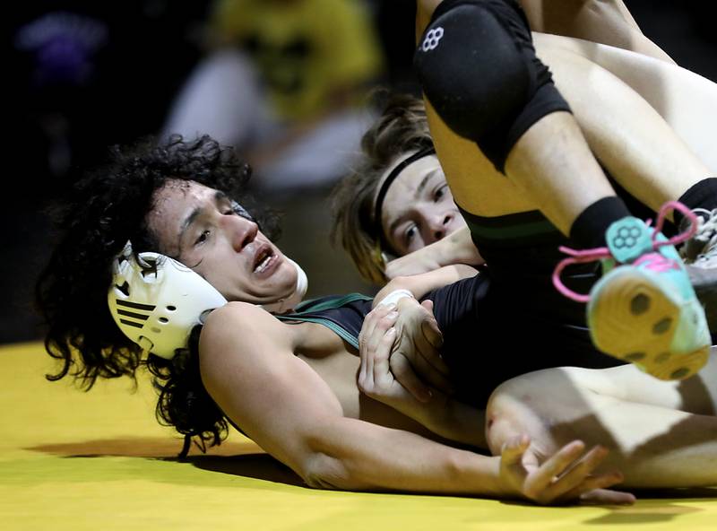 Hampshire’s Lou Jensen tries to pin Crystal Lake South’s Ricky Briones during the 126-pound match of a Fox Valley Conference wrestling meet on Thursday, Jan. 15, 2026, at Crystal Lake South High School.