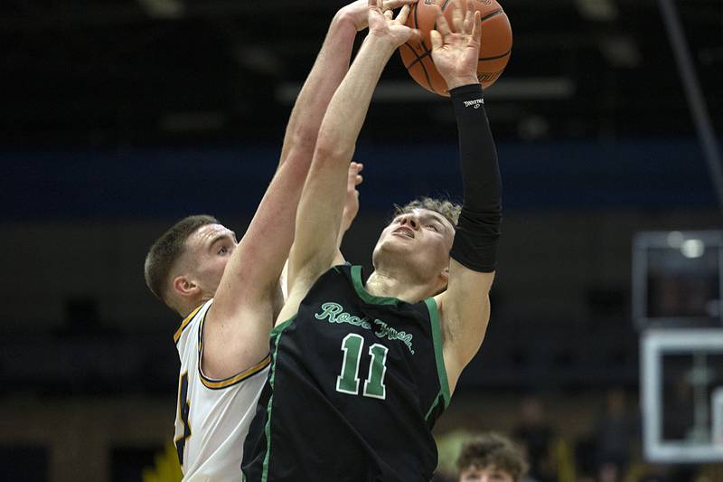 Sterling’s Lucas Austin puts a block on Rock Falls’ Gavin Sands Tuesday, Nov. 29, 2022.