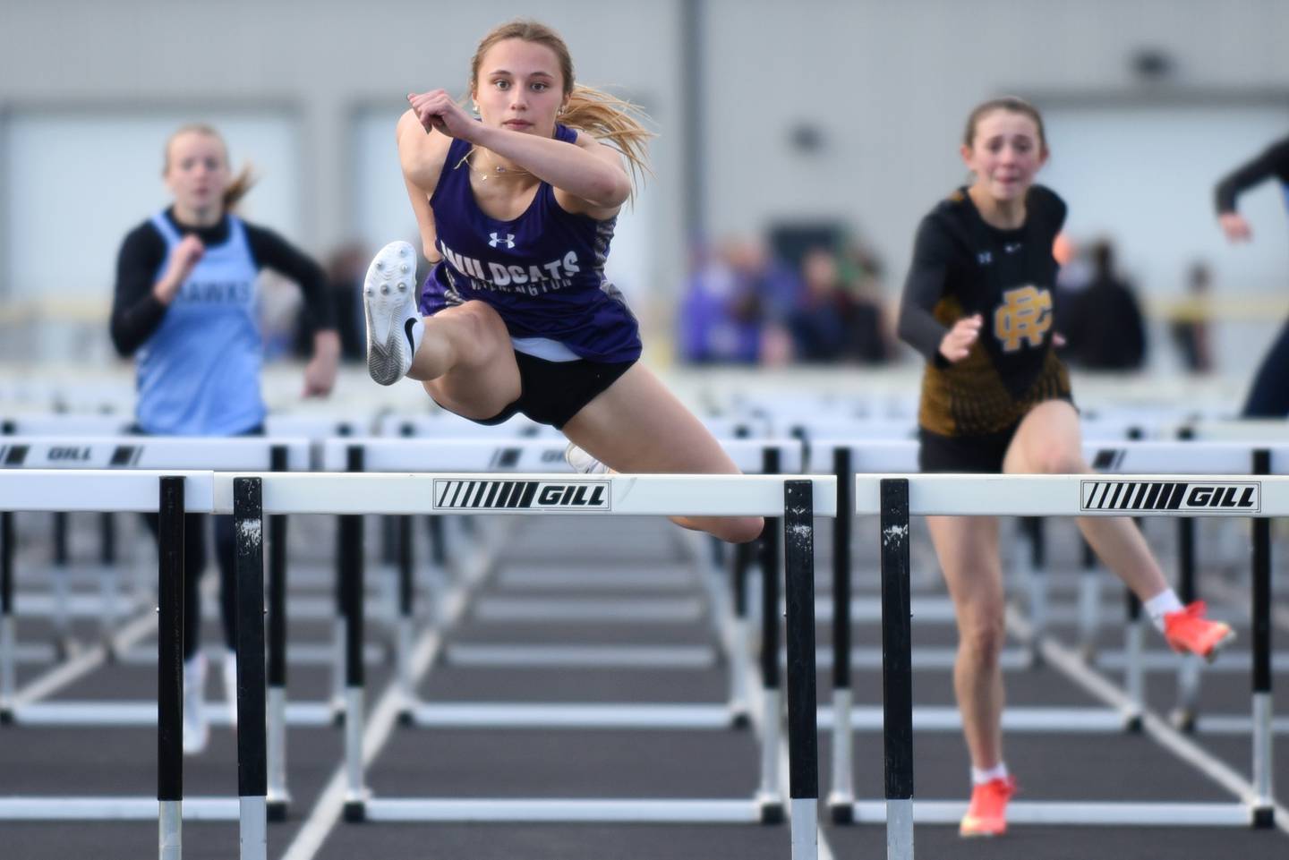 Wilmington's McKenna Van Tilburg leads the pack to the finish line of the 100 hurdles at the Herscher Invite Friday, May 1, 2026.