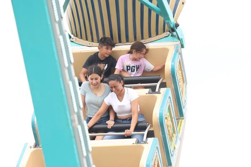 A family braves on of the rides on day 2 of the Taste of Joliet. Saturday, June 25, 2022 in Joliet.