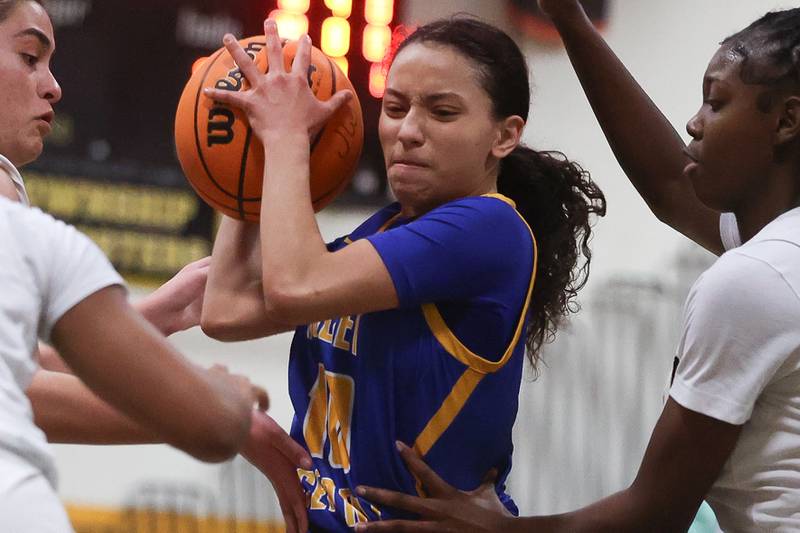 Joliet Central’s Elena Moody battles to the basket against Joliet West on Thursday, Jan 30, 2025 in Joliet.