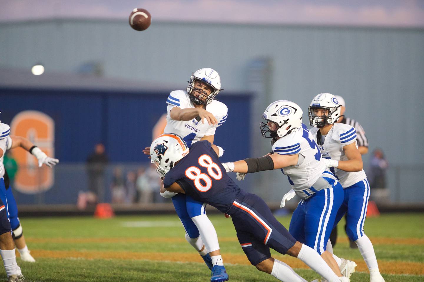 Geneva's Benjamin Peterson throws a pass as Oswego's Tristan Thomas makes the tackle on Friday, Sept. 5, 2025 in Oswego.