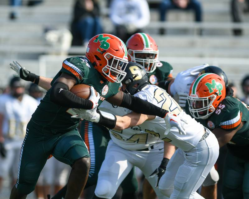 Morgan Park’s Keshawn Lewis-Hunt (24) tries to get around Sycamore defenders during the first quarter of the game on Saturday Nov. 4, 2023, held at Gately Stadium in Chicago.