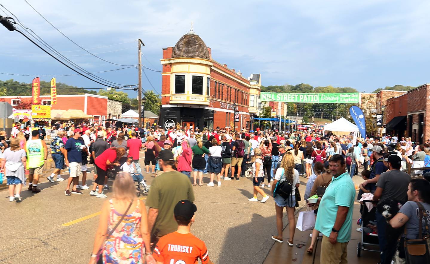 People gather on Mill Street downtown Utica for the  51st annual Burgoo festival on Sunday Oct. 9, 2021.