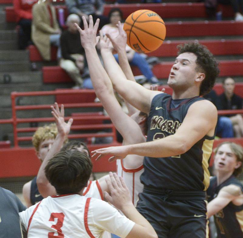Morris’s Colin Pfeiffer fights the Ottawa defense for a rebound in the 2nd period Tuesday at Ottawa.