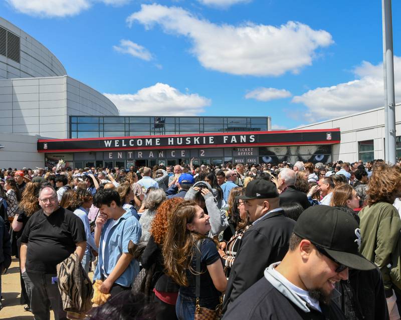 Friends and family wait outside the Convocation Center after the Oswego East graduation commencement ceremony was completed on Saturday May 17. 2025, held at the Convocation Center in DeKalb.