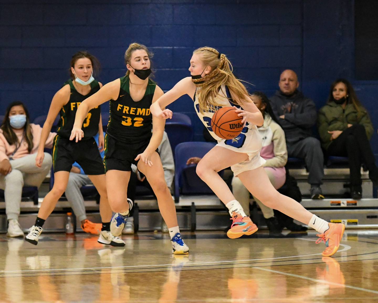 Geneva Lauren Slagle (33) drives to the basket in the second quarter while being defended by Fremd Maddy Fay (32) on Thursday during the championship game at Morton College in Cicero.