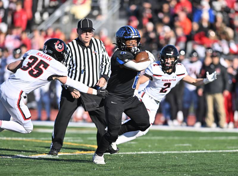 Lincoln-Way East's Nuri Muhammad rushes the ball for a big gain during the IHSA class 8A semifinals playoff game against Barrington on Saturday, Nov. 18, 2023, at Frankfort. (Dean Reid for Shaw Local News Network)