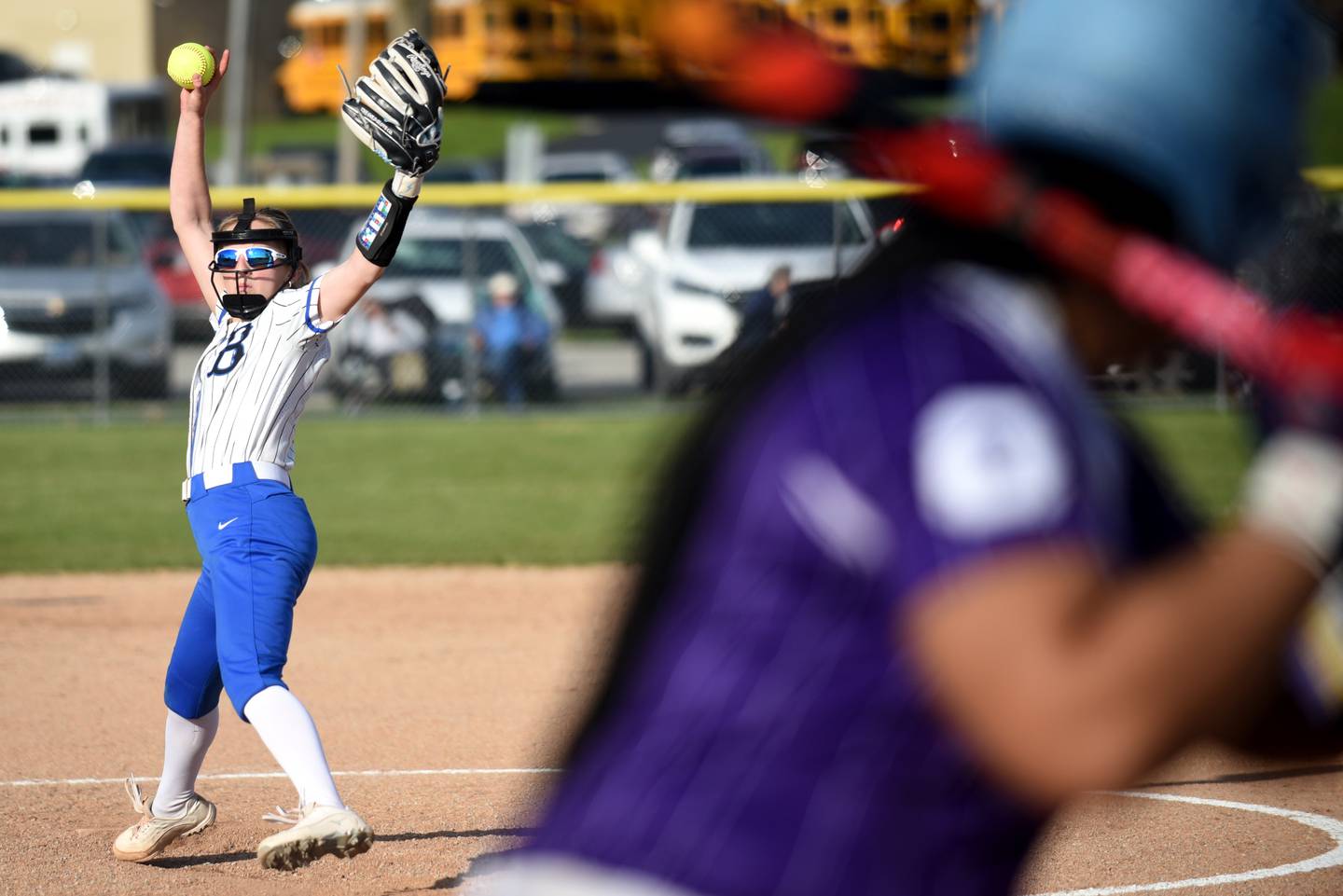 Milford-Cissna Park's Kami Muehling, left, throws a pitch to Oakwood's Je'Lanna Tall during a game at Milford Wednesday, April 16, 2025.