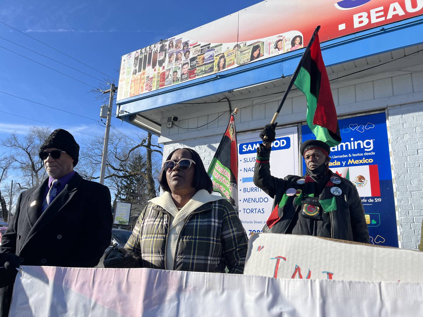 Adrienne Cooper Williams, of Joliet, speaks at a rally held on Saturday, Jan. 4, 2025, outside Sam Food Mart, 121 Richards St., Joliet.