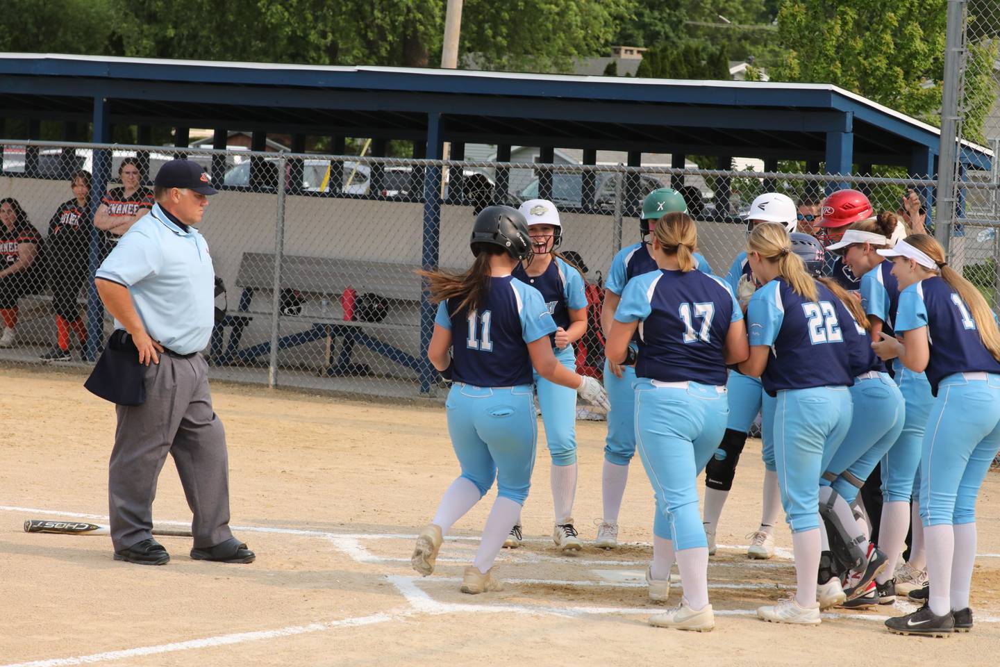 Bureau Valley pitcher Madison Smith gets a welcome home after hitting a two-run-homer in the first inning in Wednesday's regional softball game at Princeton.
