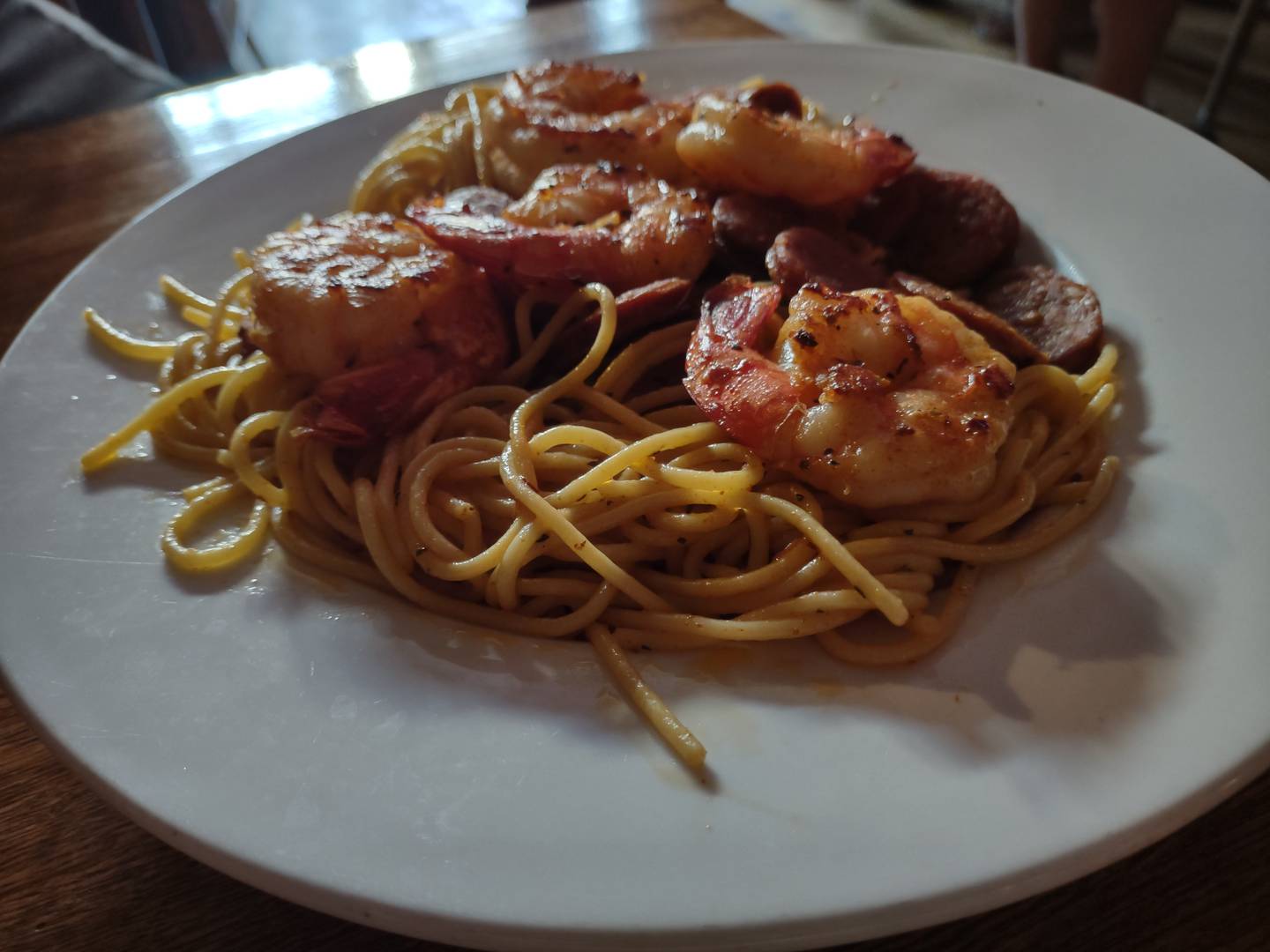 Jumbo shrimps top the andouille and shrimp scampi pasta dish at Canal Port in Utica.