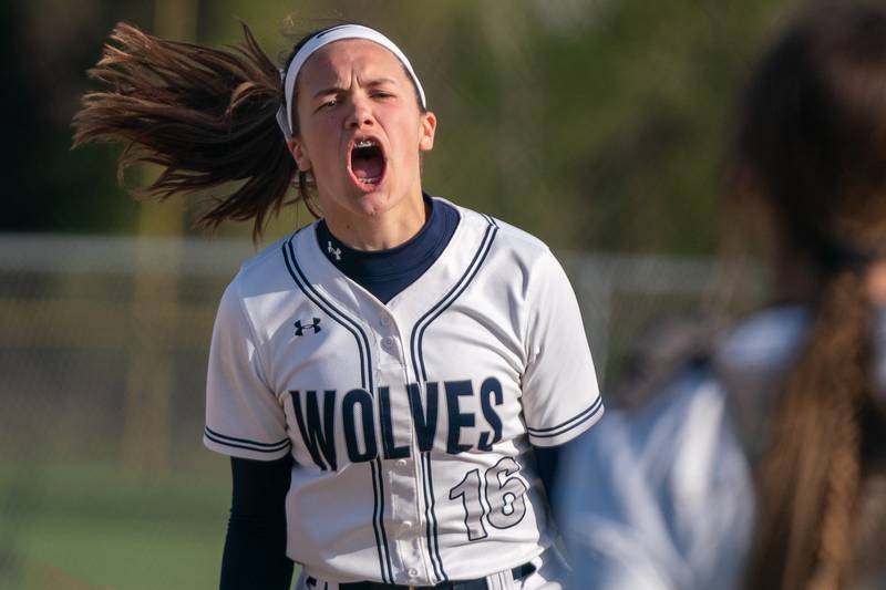 Oswego East's Catie Sloan (16) reacts during the end of a softball game after defeating Oswego at Oswego East High School on Friday, April 21, 2023.