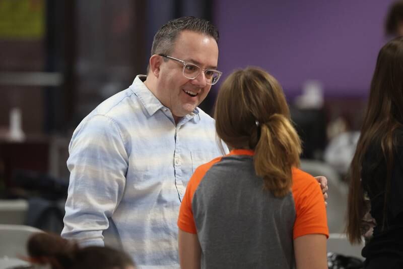 Lincoln-Way West’s bowling coach Scott Ullian talks with one of his bowlers during practice at Laraway Lanes in New Lenox.