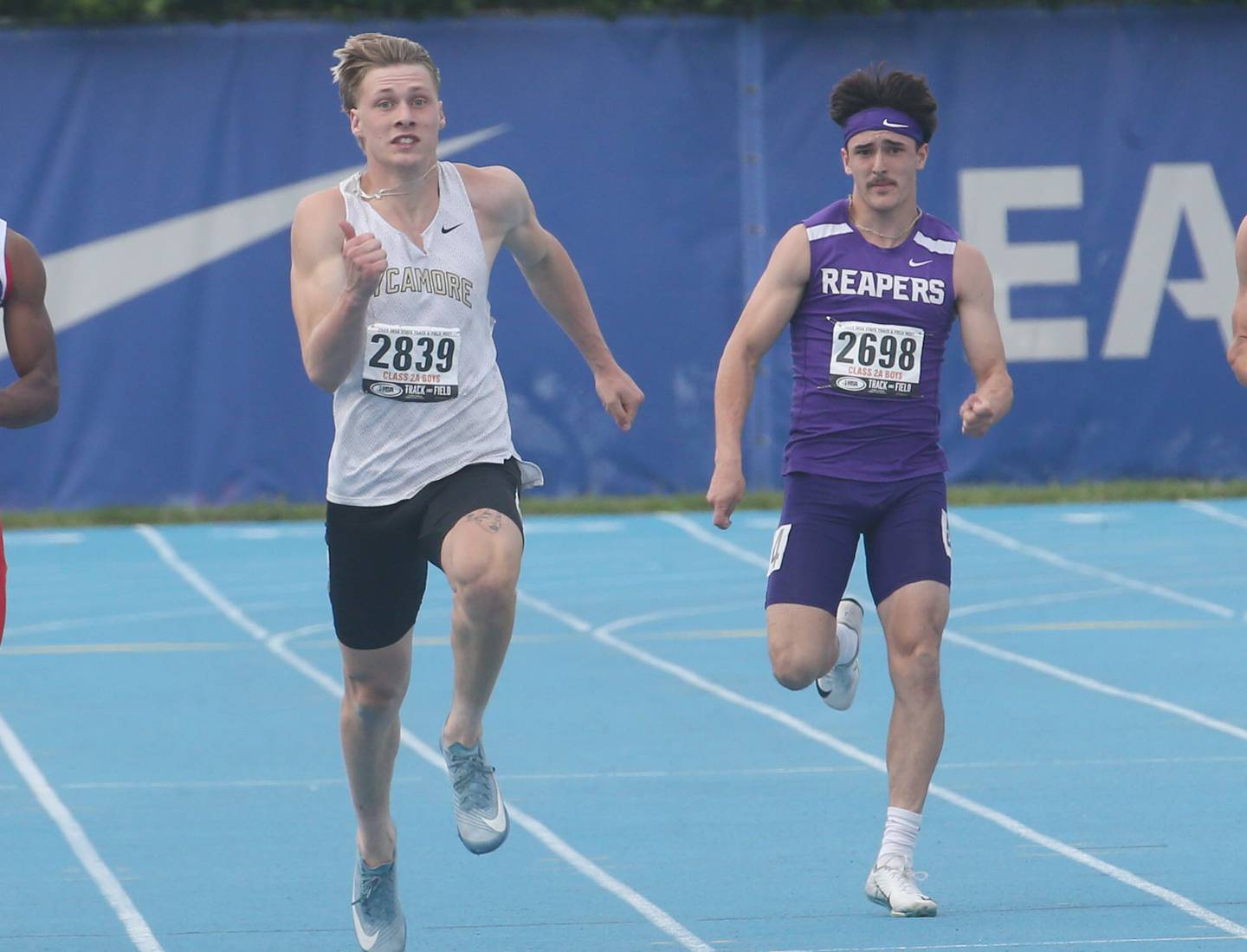 Sycamore's Aidan Wyzard and Plano's Tristan Meszaros compete  in the 200 meter dash during the IHSA Class 2A Boys Track & Field State Finals on Saturday, May 31, 2025 at Eastern Illinois University in Charleston.