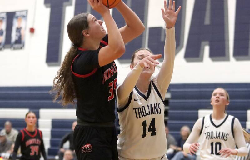 Huntley’s Paula Strzelecki, left, takes a shot as Cary-Grove’s Avery Stortz defends in varsity girls basketball on Friday, Jan. 24, 2025, at Cary-Grove High School in Cary.
