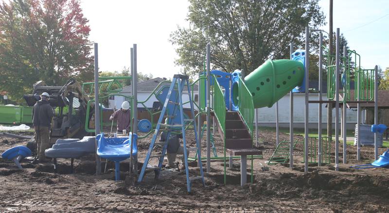 A crew from Custom Playgrounds in Rockford install new playground equipment at Sunset Park on Tuesday, Oct. 17, 2023 in Peru. Installation began this week on about $150,000 of upgraded playground equipment located on the south east part of Sunset Park near the intersection of 2nd and Henry Streets. The city received a grant of $43,000 for the new playground. Crews are hoping to have it completed by next week.