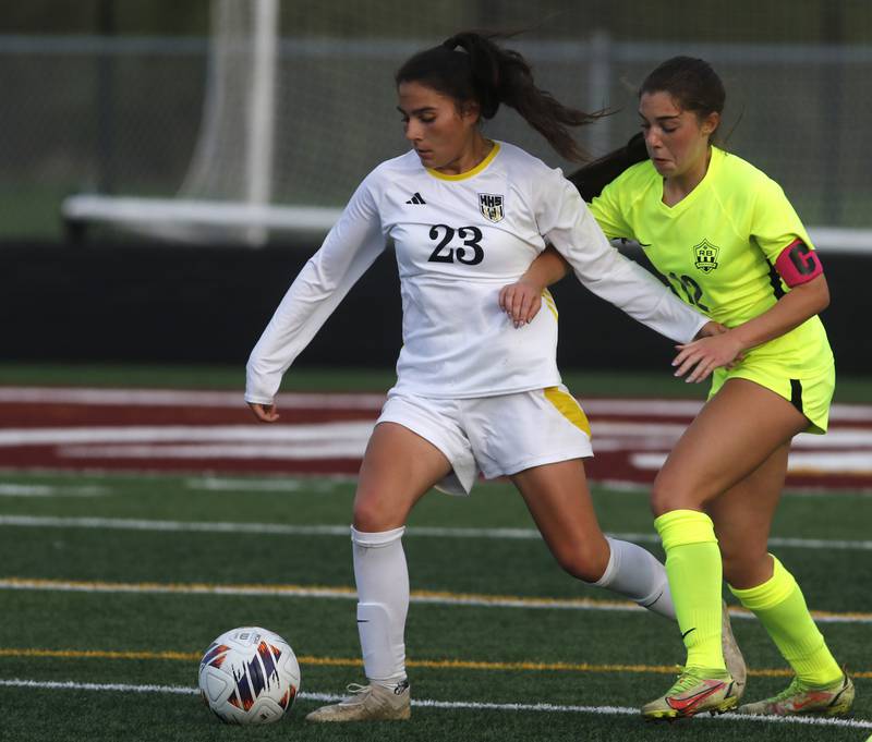 Harvard's Julie Silva controls the ball in front of Richmond-Burton's Nicole Mendlik during the Kishwaukee River Conference Girls Soccer Tournament Championship Match on Wednesday, May 7, 2025, at HRichmond-Burton High School in Richmond.