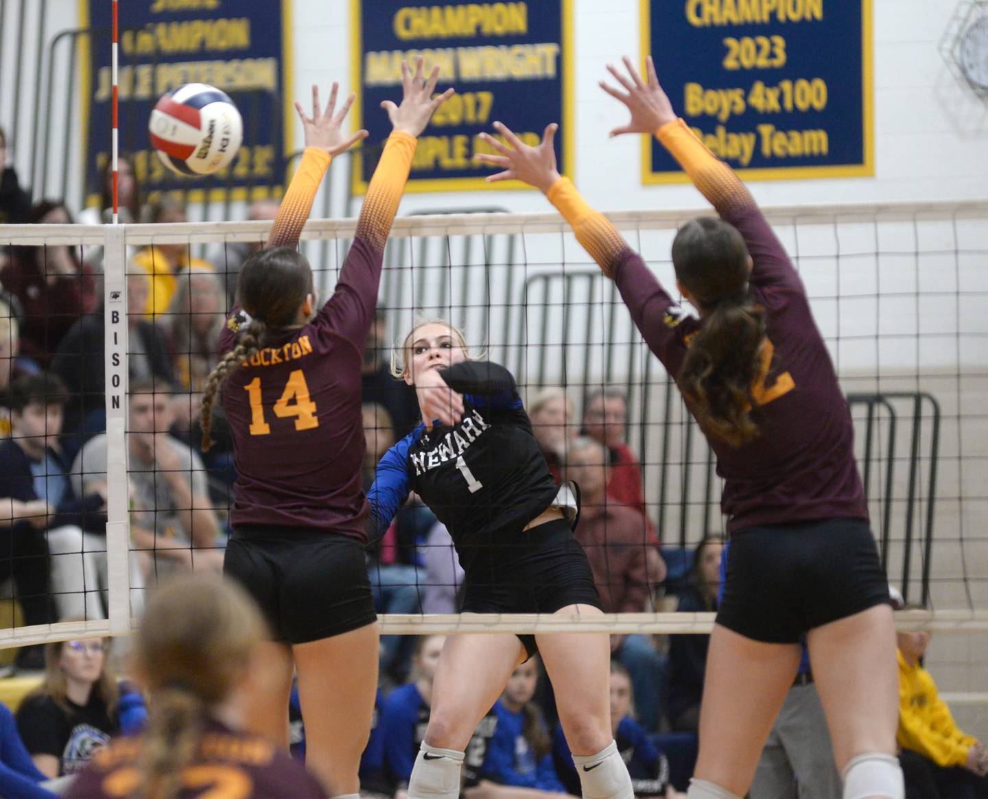 Newark's Addison Ness (1) spikes the ball past Stockton's Kacy Wright (2) and Emma Eisfeller (14) during 1A action at the Polo Sectional on Tuesday, Nov. 5, 2024 at Polo High School.
