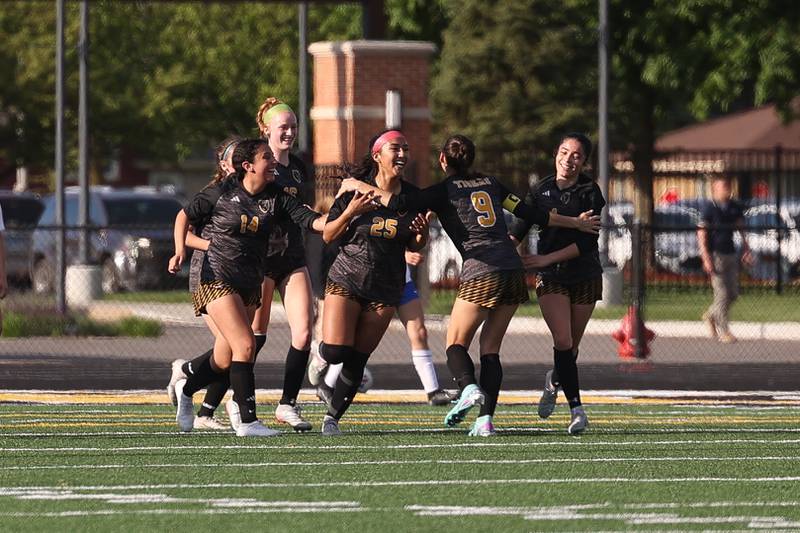 Joliet West’s Patricia Villalpando, 25, is mobbed by teammates after her goal against Joliet Central on Tuesday, April 30, 2024.