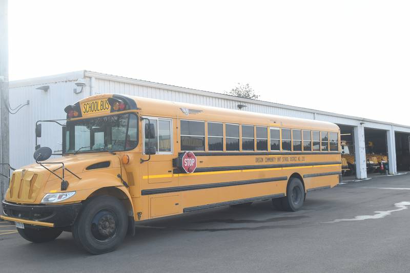 An Oregon school bus sits in front of the bus garage located south of the high school in Oregon.