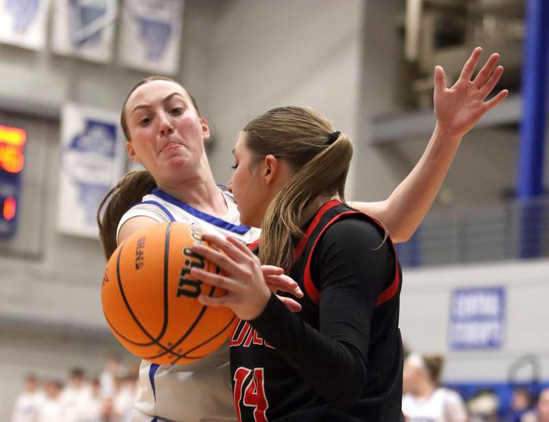 Huntley’s Sara Bruns, front, keeps the ball from Burlington Central’s Audrey LaFleur  in varsity girls basketball on Monday, Feb. 9, 2026, at Central High School in Burlington.