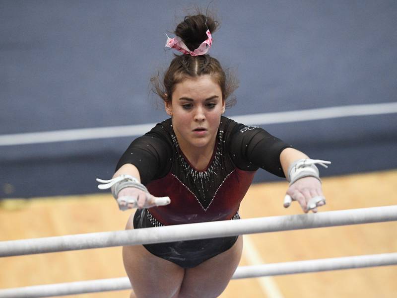 Prairie Ridge co-op's Gracie Willis performs on the uneven parallel bars at the Hoffman Estates girls gymnastics sectional meet Feb. 9, 2022.