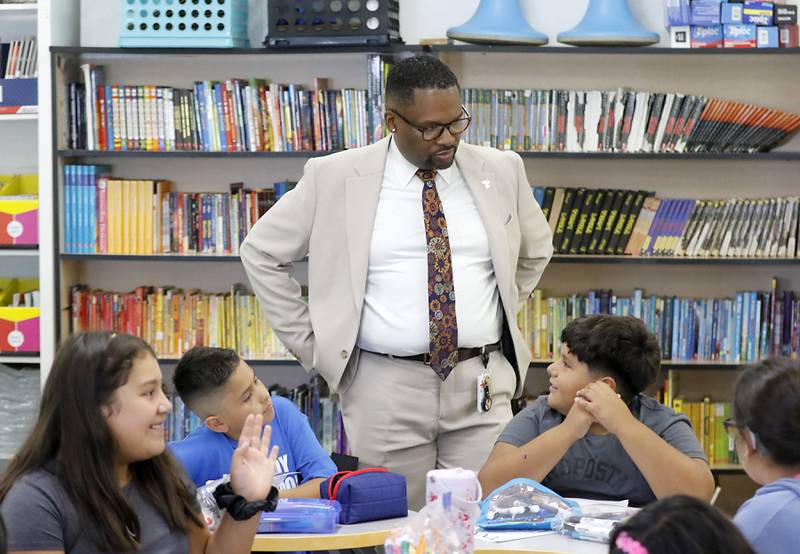 Harvard School District 50 Superintendent Brandon White visits with fifth grade students at Jefferson Elementary School during the first day of school on Wednesday, Aug. 13, 2025, in Harvard. White was previously was the superintendent of Cary School District 26.