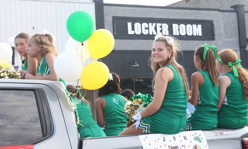 JFK Elementary School cheerleaders ride during the Homecoming parade on Thursday, Sept. 18, 2025 downtown Spring Valley.
