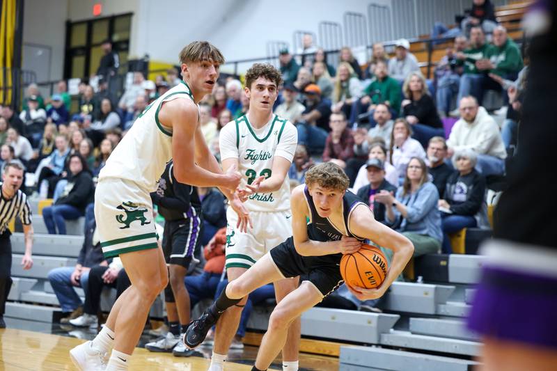 Bishop McNamara's Coen Demack, left, and Karter Krutsinger and El Paso-Gridley's Jack Hempstead all look to the referee for the call during the Fightin' Irish's 66-52 victory over El Paso-Gridley in the IHSA Class 2A Herscher Regional championship on Friday, Feb. 27, 2026.